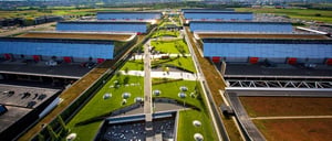 The Stuttgart Trade Fair Center, featuring a green roof, solar panels, and modern architecture.