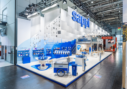 ET GLOBAL's German Design Award 2027 winning exhibition stand for sappi with paper rolls as a main interior design element.